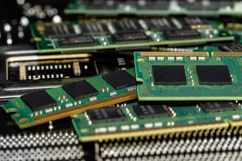 A stack of old sdram memory modules lying on a pri 03 26 23 16 49 utc