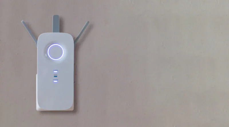 Wireless repeater wifi extender on grey empty wal 03 16 01 22 52 utc
