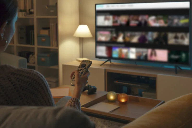 Woman watching tv at home and relaxing 01 07 06 13 51 utc