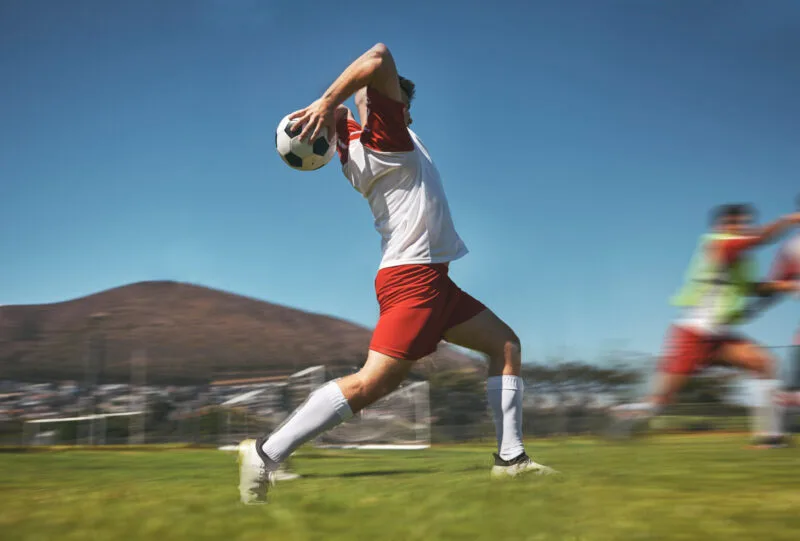 Training man and soccer ball throw on soccer fiel 01 09 09 43 38 utc