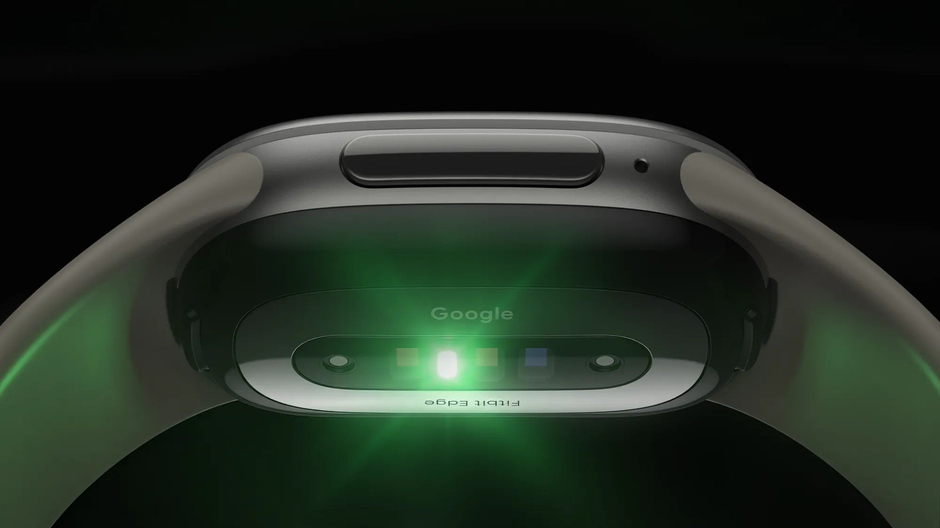 Fitbit Edge Partea din spate a brățării Google Fitbit Edge, cu senzorii de puls aprinși în verde